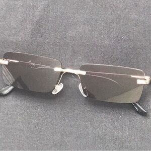 black tinted sunglasses, with hints of gold detailing at the front and side